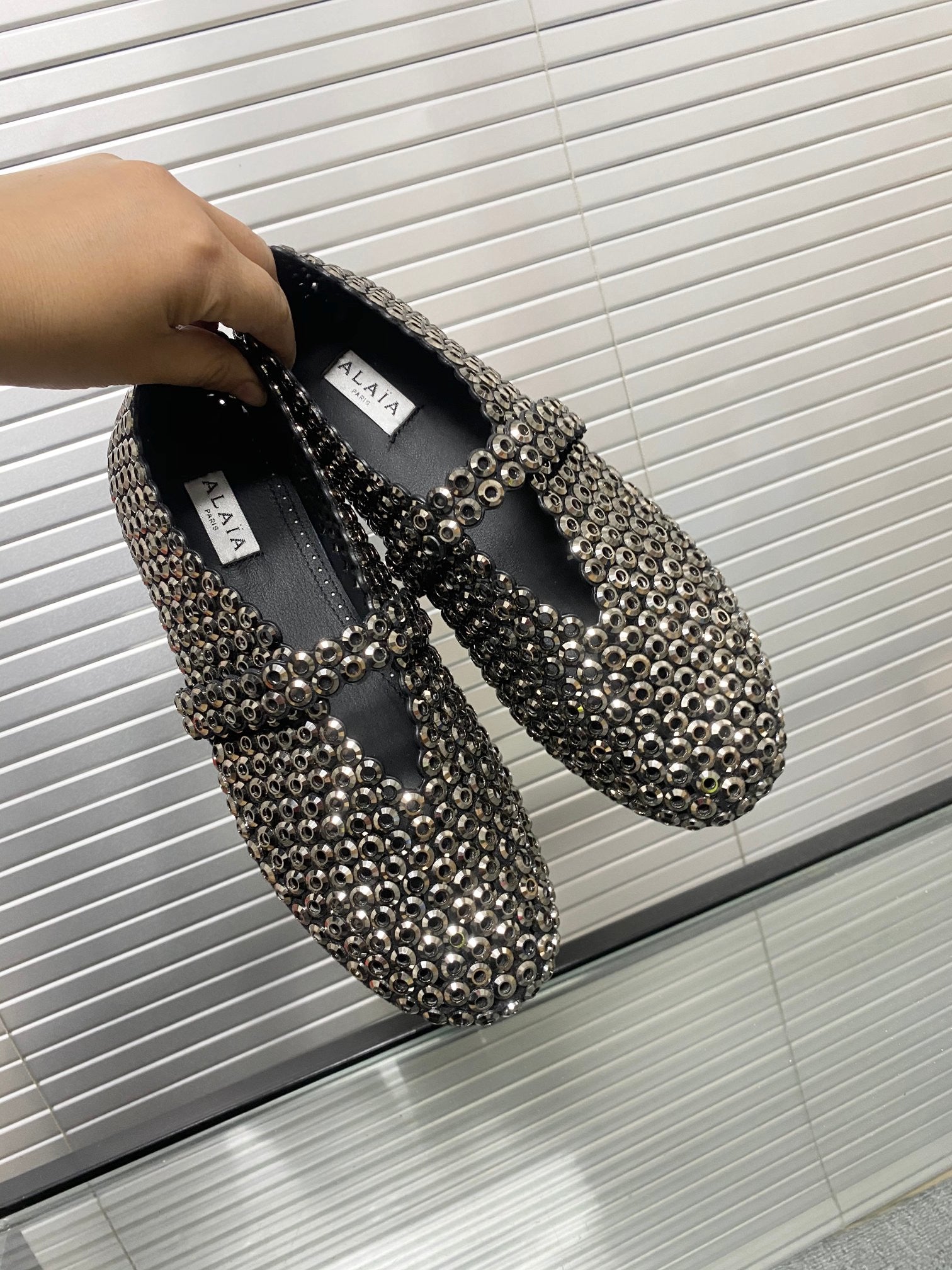 Alaia ballet flats in glass
