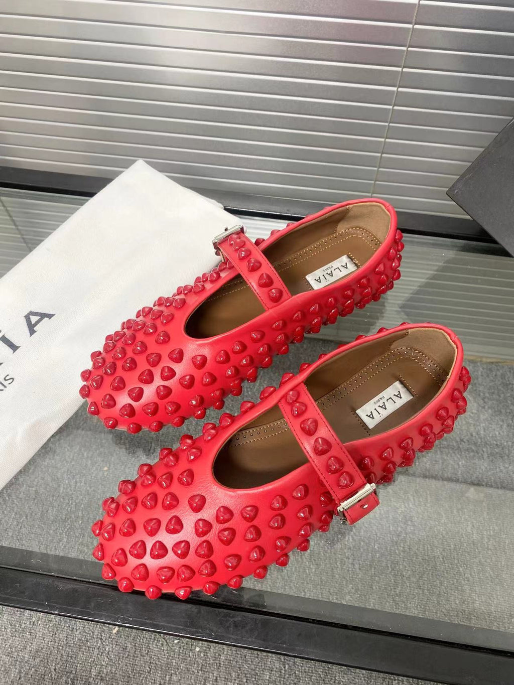 Alaia ballet flats red
