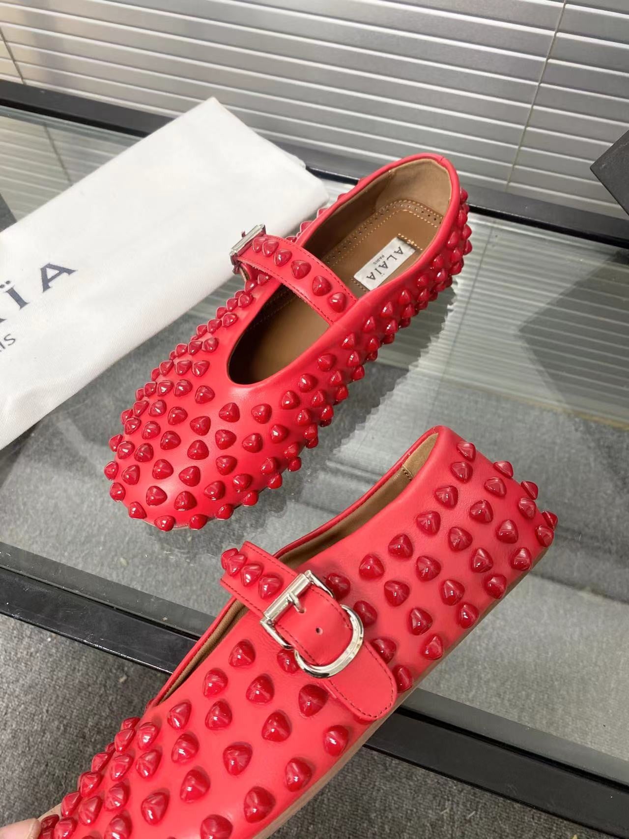 Alaia ballet flats red
