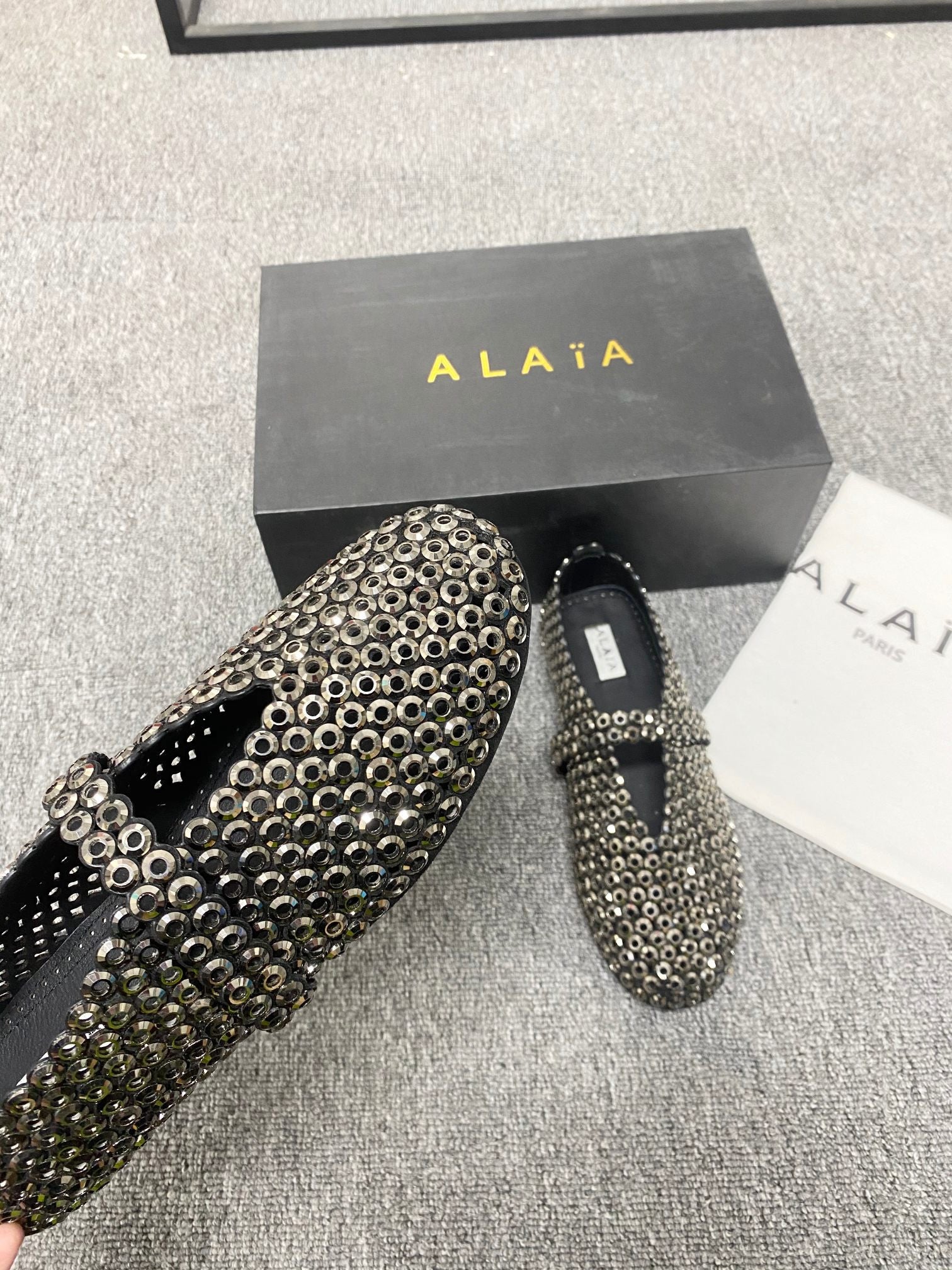 Alaia ballet flats in glass
