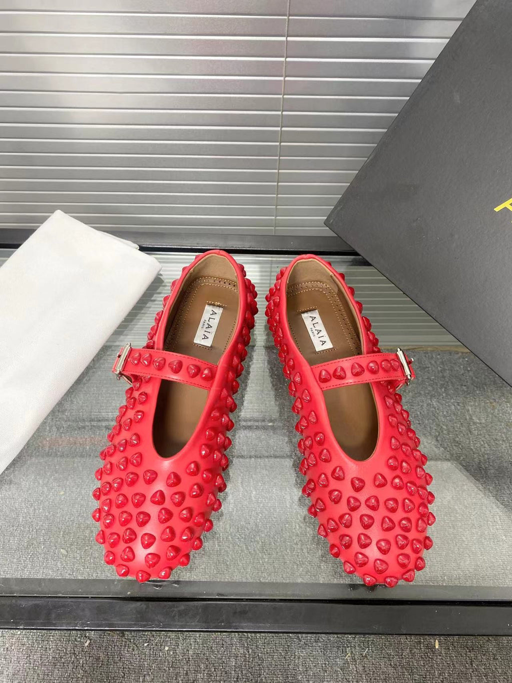 Alaia ballet flats red