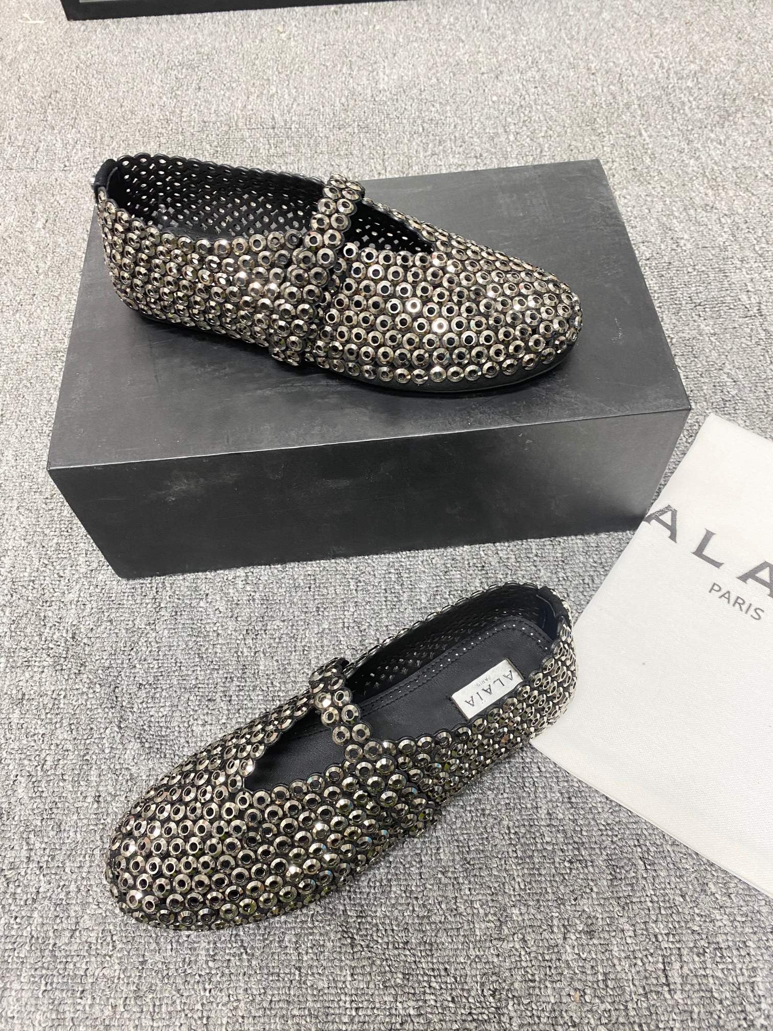 Alaia ballet flats in glass