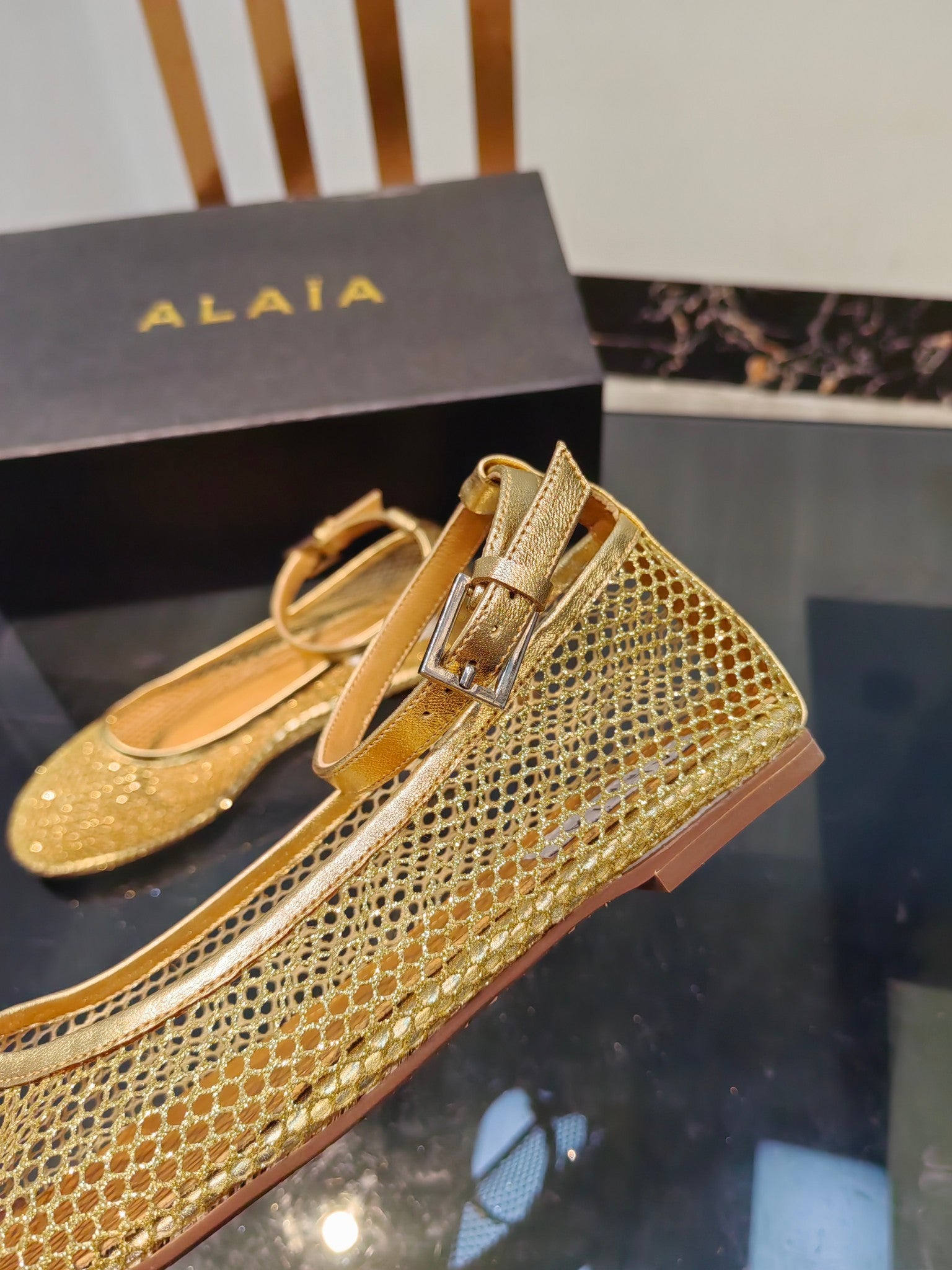Alaia ballet flats gold