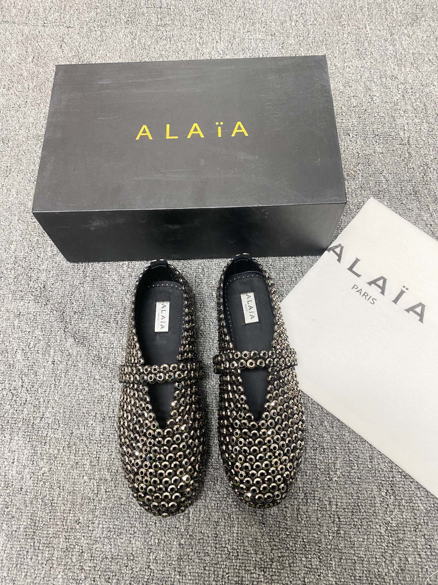 Alaia ballet flats in glass