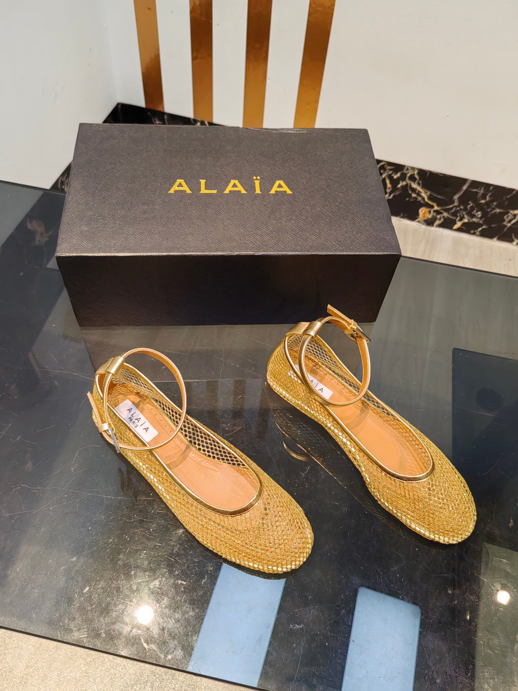 Alaia ballet flats gold