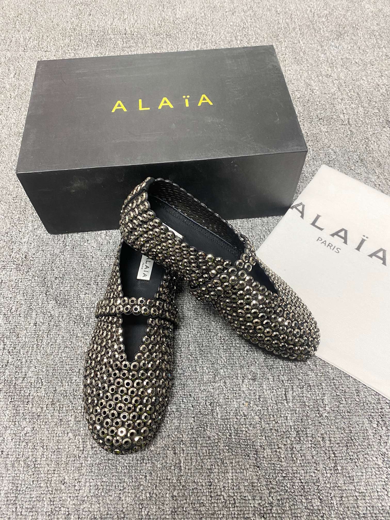 Alaia ballet flats in glass