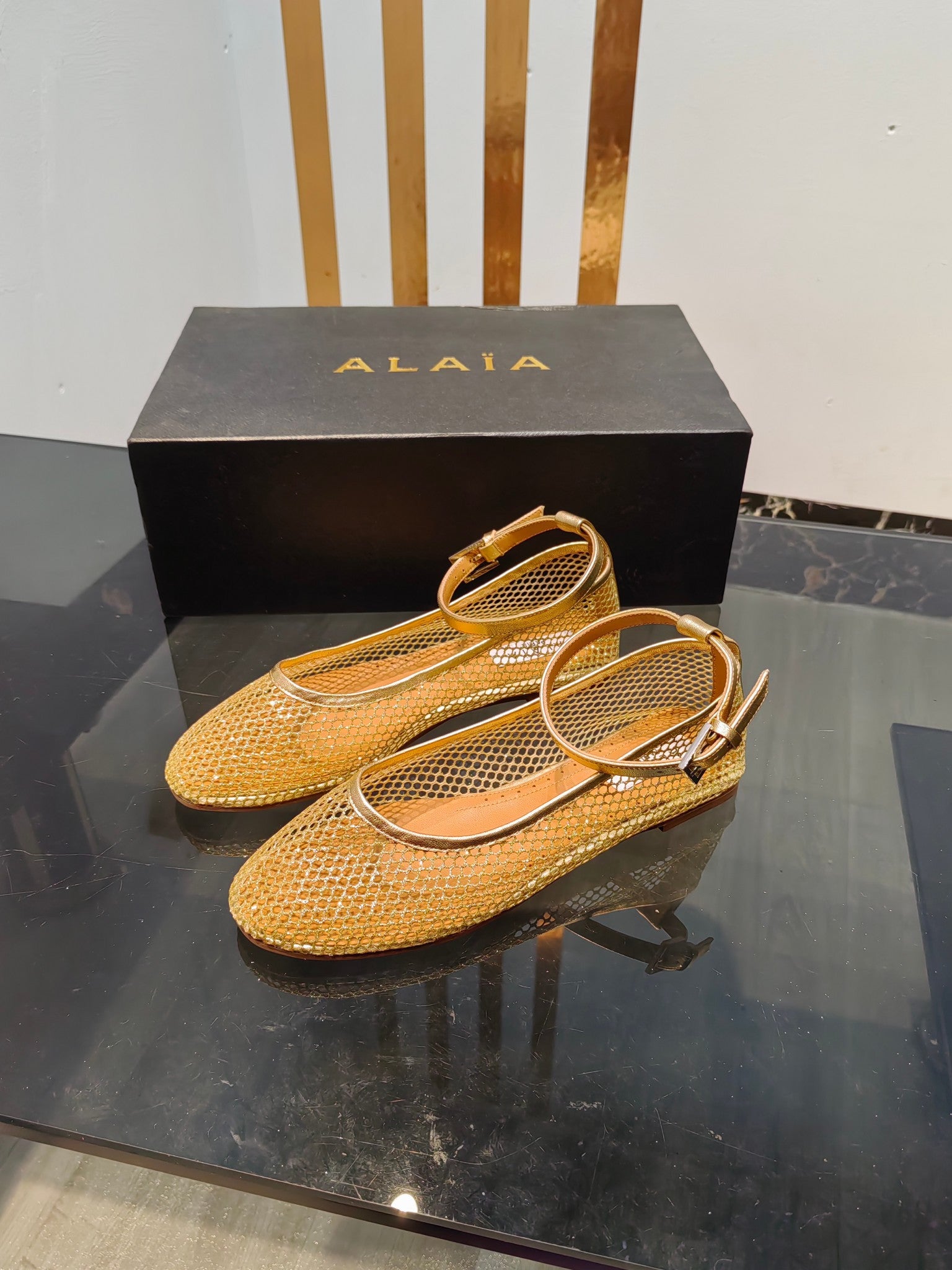 Alaia ballet flats gold